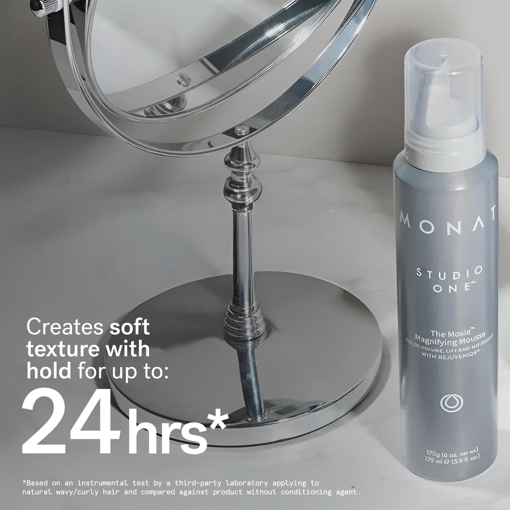 MONAT Moxie Magnifying Mousse in use while blow-drying for added lift.