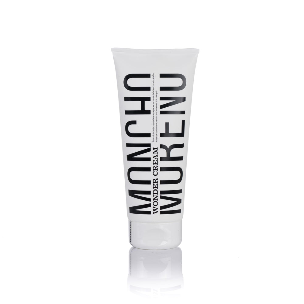 MONCHO MORENO Wonder Cream bottle showcases salon-grade conditioning for damaged hair.