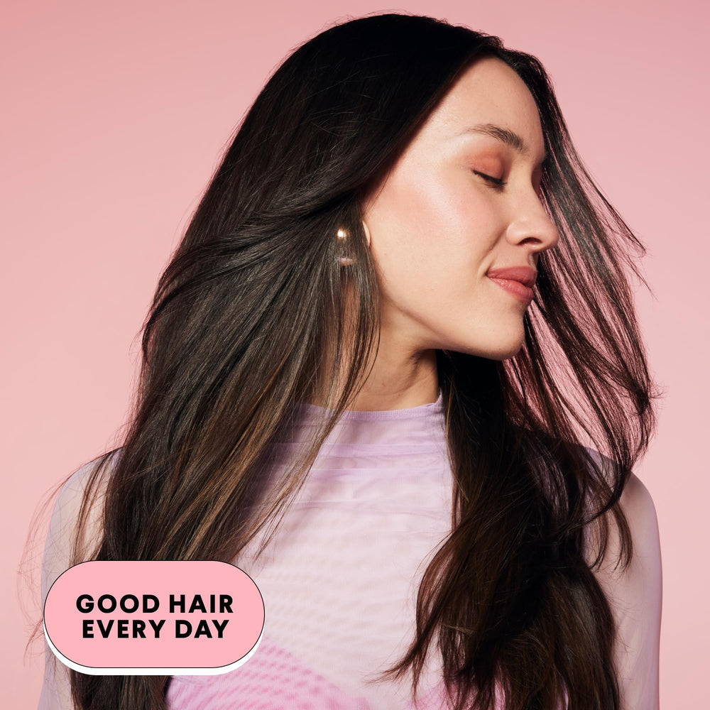 MONDAY SMOOTH conditioner on curly hair model shows a smooth finish.