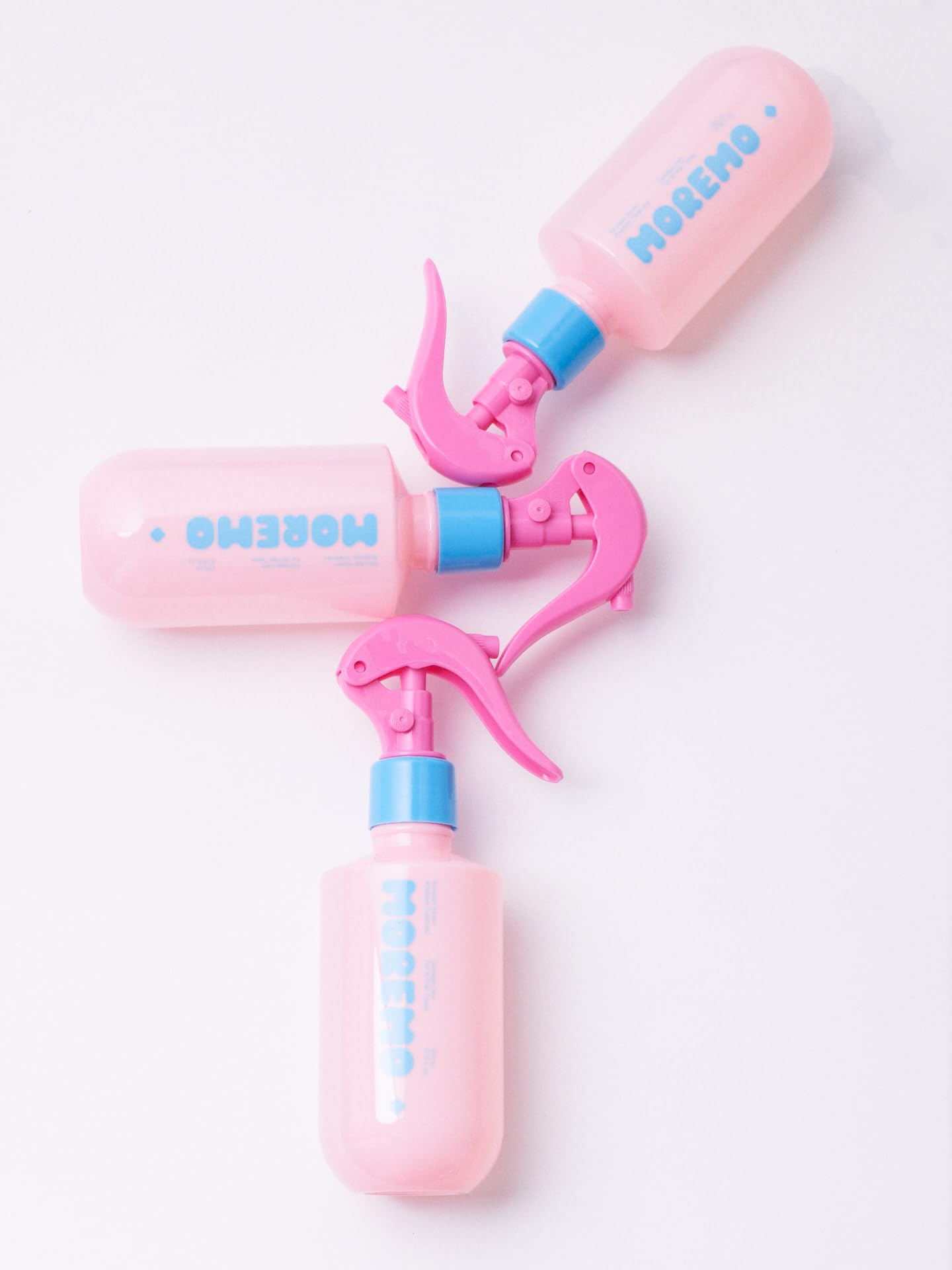 Moremo No-Wash Keratin Ampoule spray nozzle close-up demonstrating precise, targeted use on damp strands