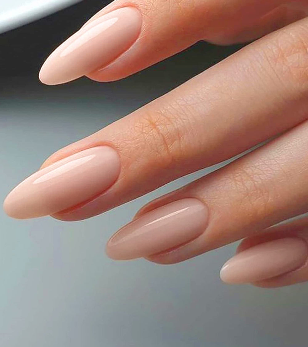 Morily press-on nails in nude almond with a glossy pink finish for chic everyday wear.