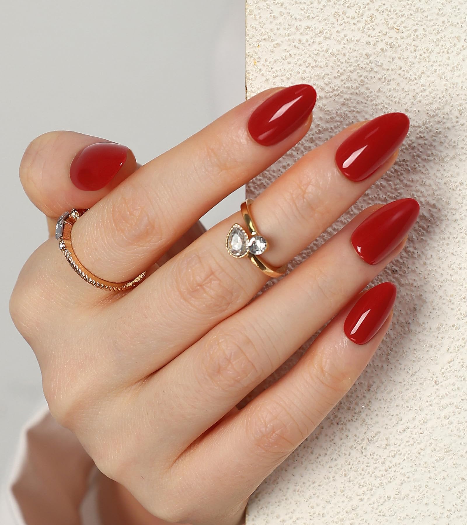 Morily red press-on nails in a short almond shape with glossy finish for quick glam.