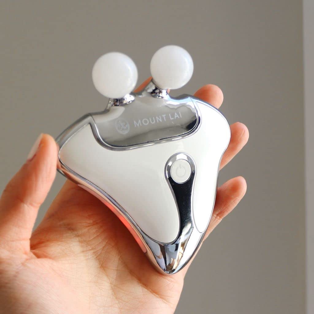 Mount Lai device highlighting heat therapy function warming facial muscles.