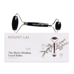 Mount Lai Warming Black Obsidian Roller on the face for improved circulation and relaxation
