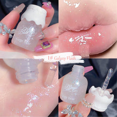 Mrettick lip gloss packaging close-up highlighting elegant design and shine.