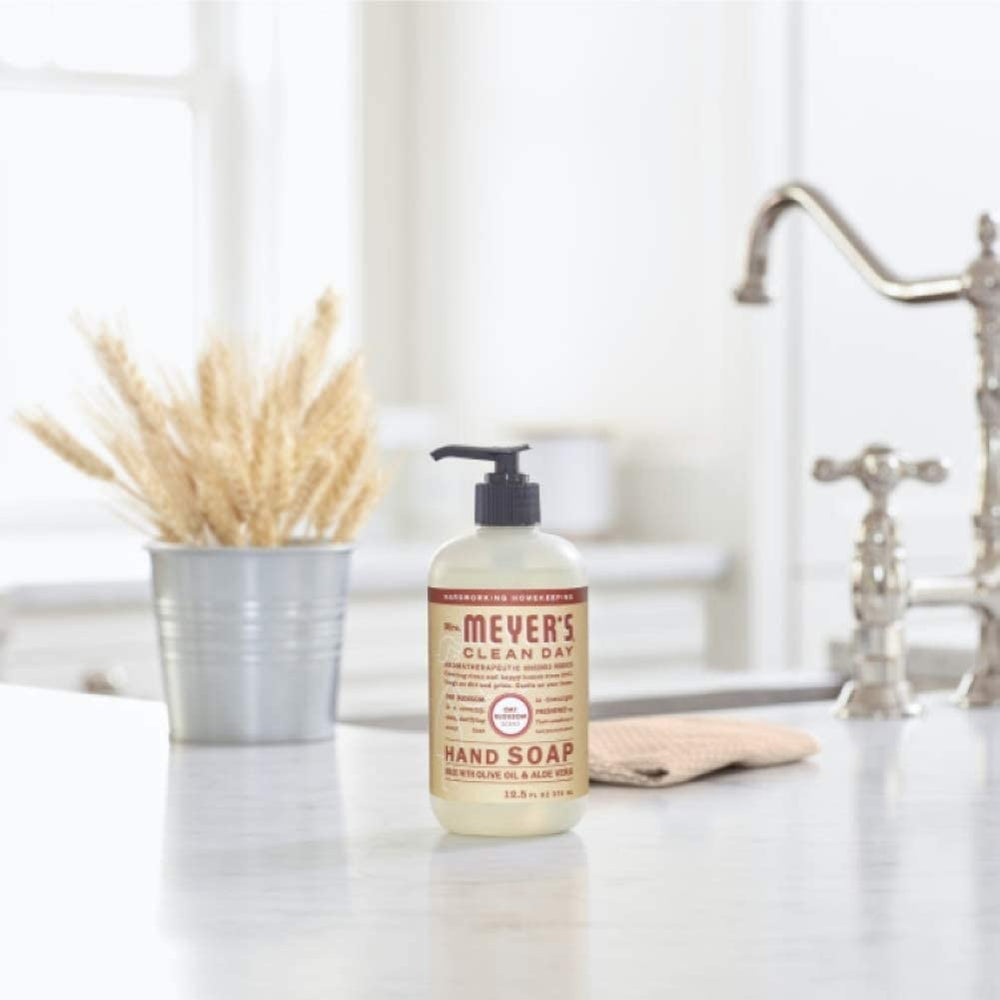 Mrs. Meyer's plum berry refill label close-up, cruelty-free credentials shown.