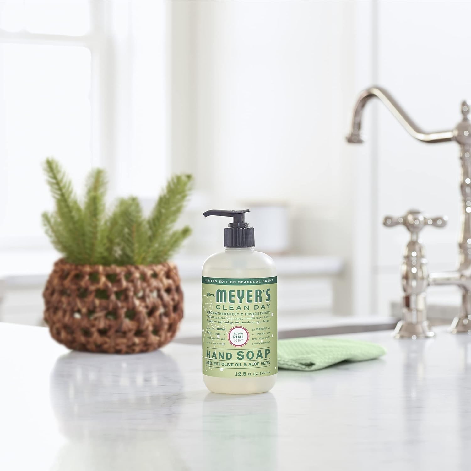 Kitchen and bathroom use highlighted for versatile hand cleansing with Mrs. MEYER'S Snowdrop.