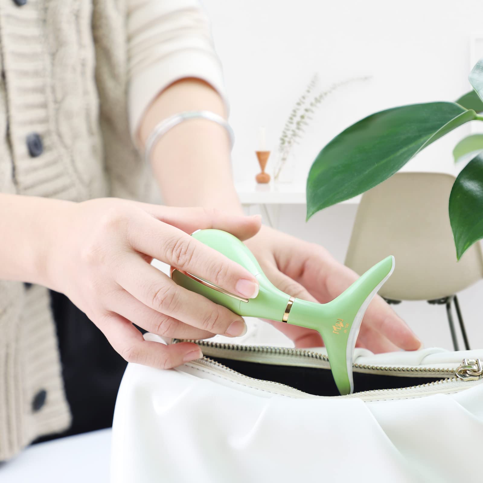 Ms.W red light massager used on the face with cream for absorption
