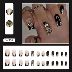 Much Hotter nails featuring black and gold foil for simple, stylish days.