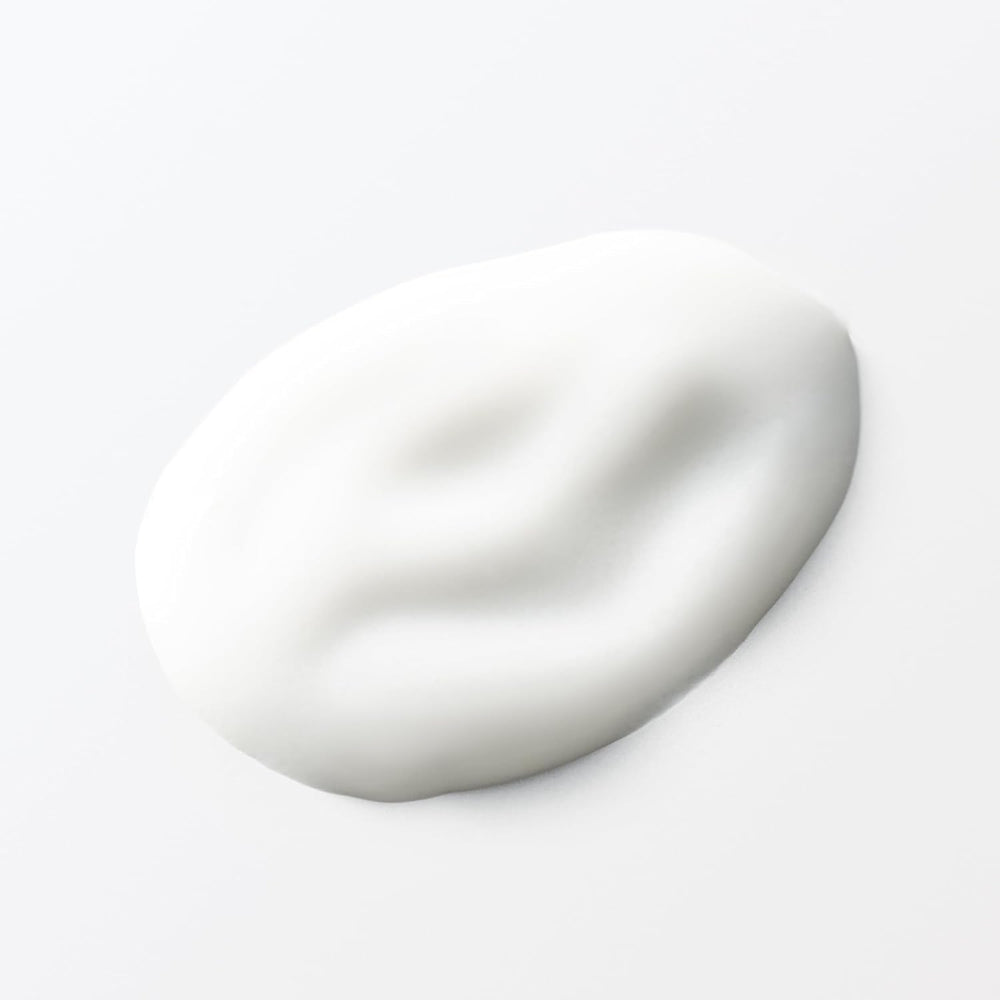 MUJI lotion in soft lighting emphasizes gentle care for delicate skin.