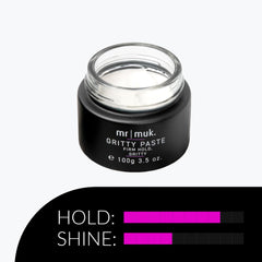 Applying paste to dry hair for long-lasting shape and texture.
