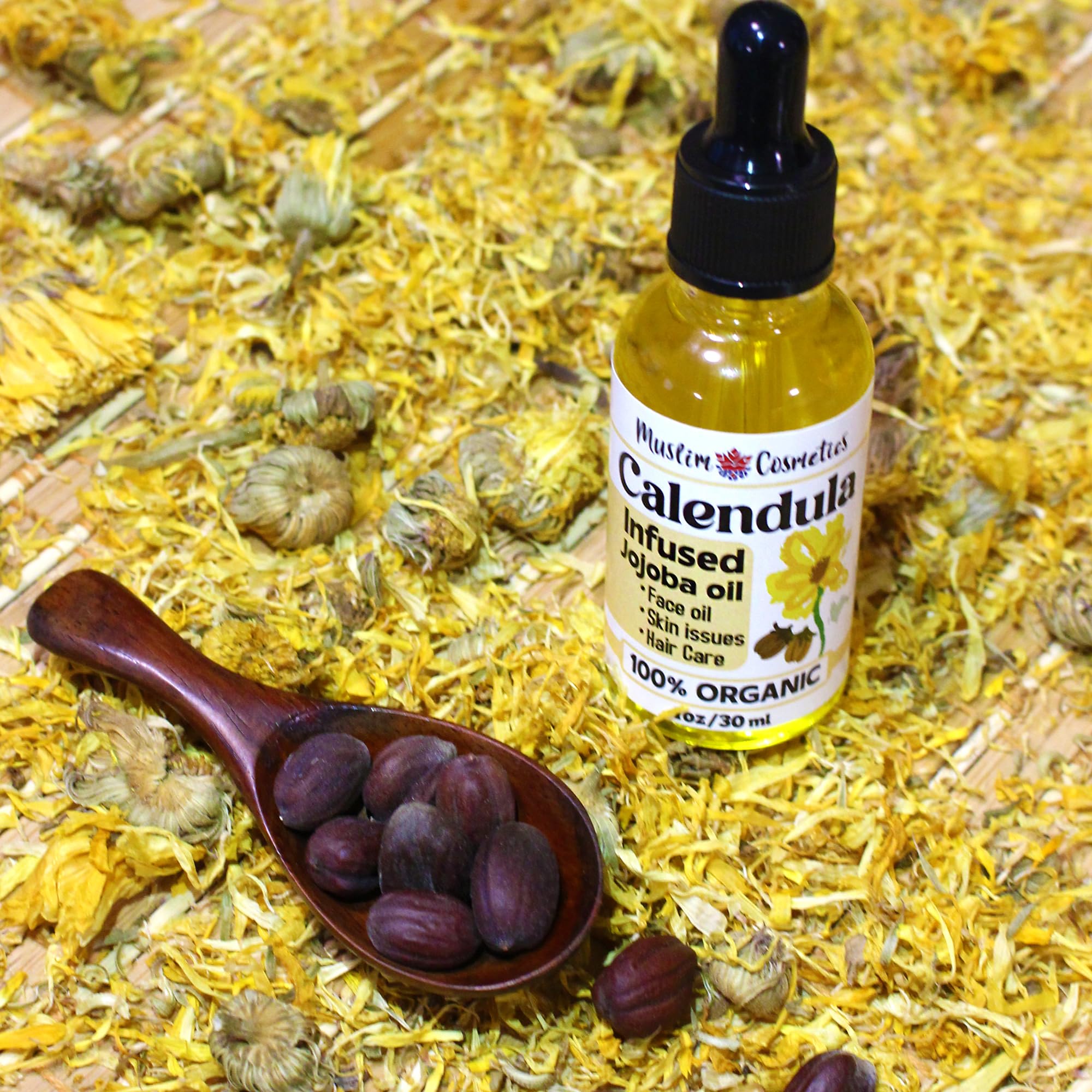 Muslim Cosmetics calendula flowers infusion in oil jar, cold-infused for purity and potency.