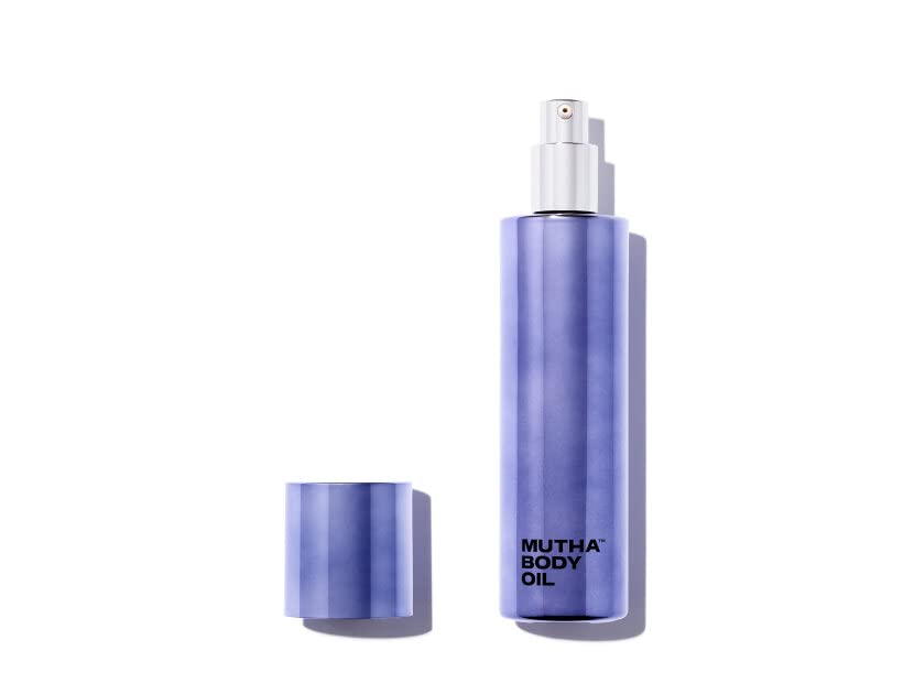 MUTHA Body Oil bottle pouring for quick hydration and glow.