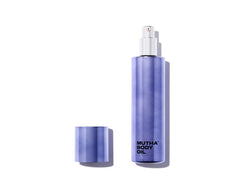 MUTHA Body Oil bottle pouring for quick hydration and glow.