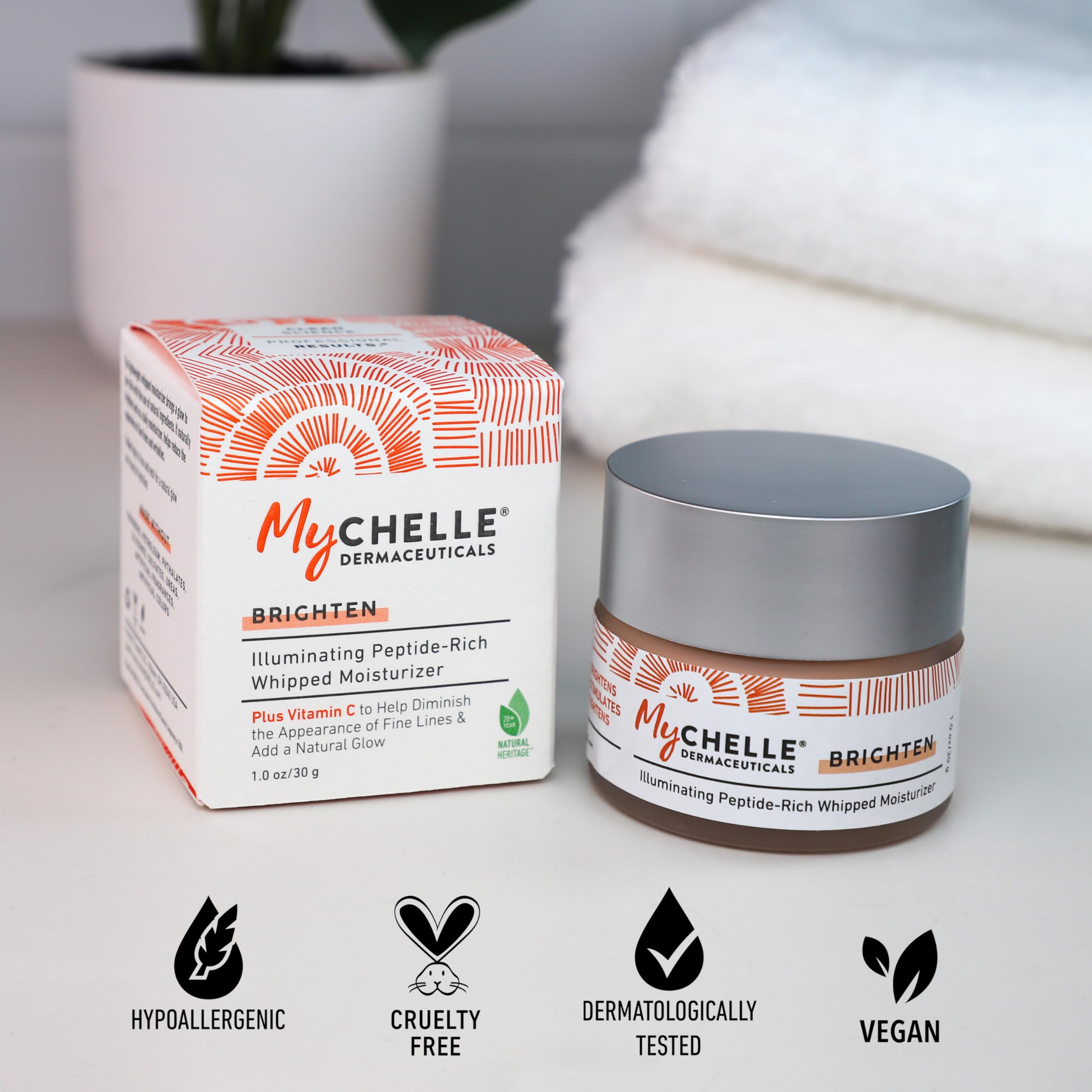 MyCHELLE Illuminating Peptide-Rich Whipped Moisturizer pump action showing easy application
