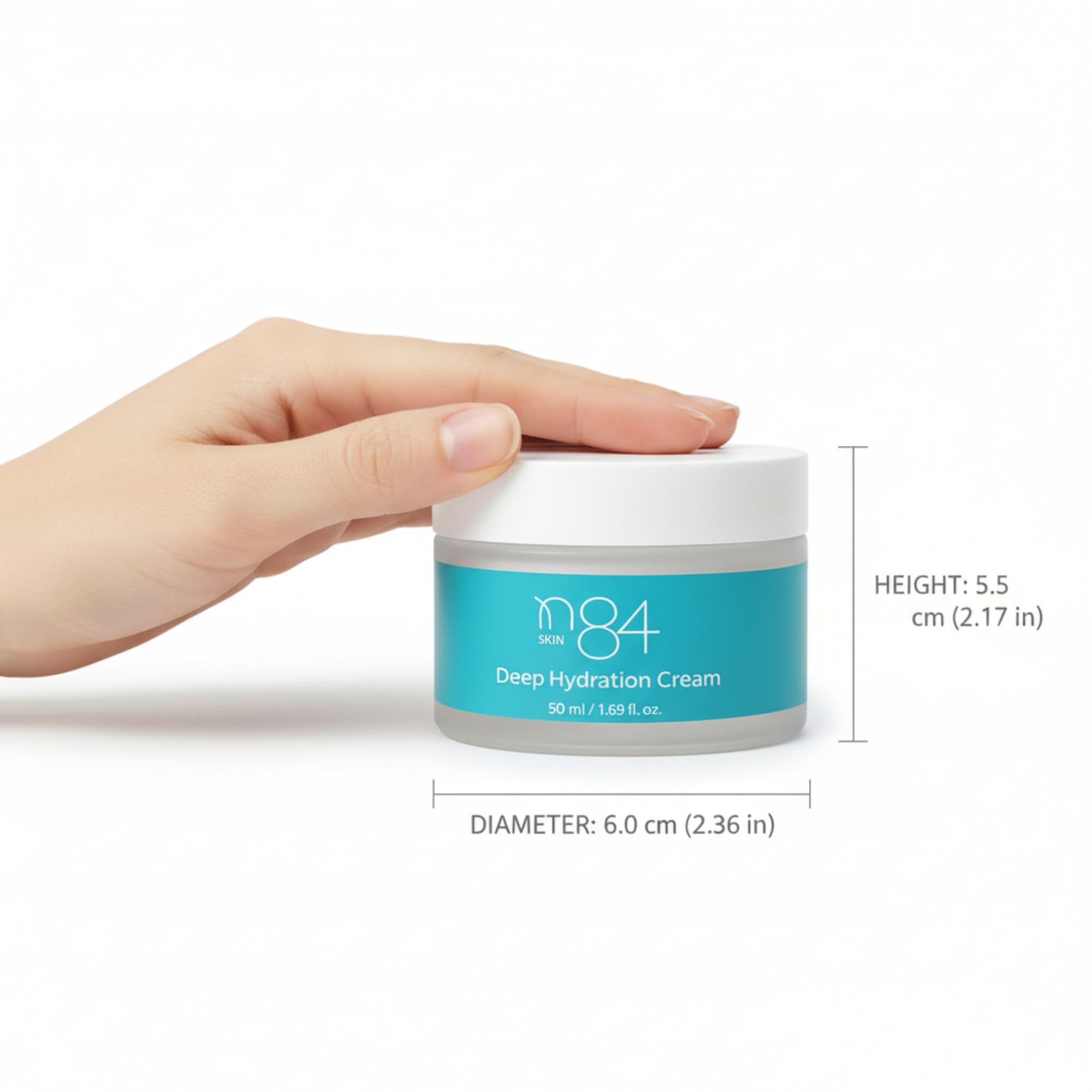 N84 Skin hand applying cream during morning skincare routine.