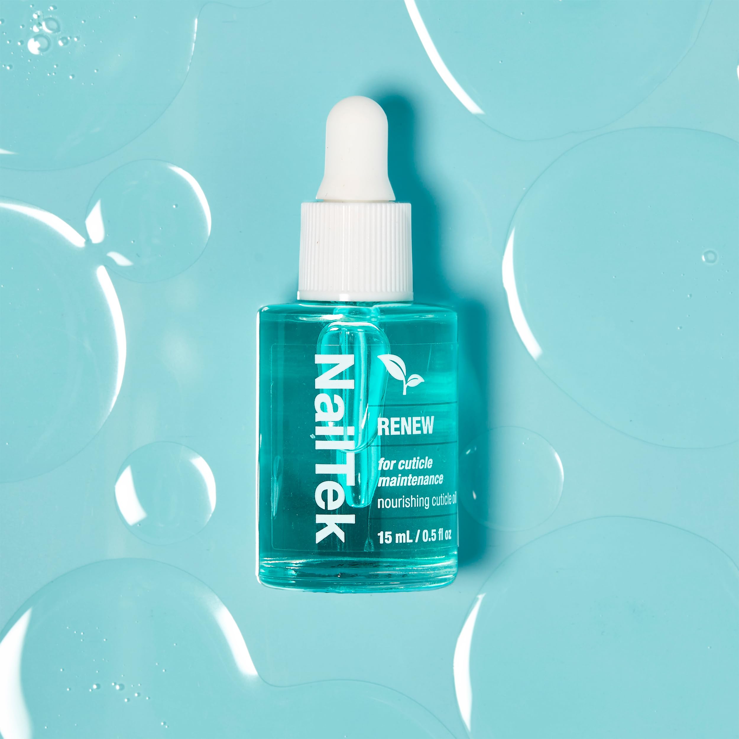 Nail Tek Renew Cuticle Oil compact bottle ready for travel.