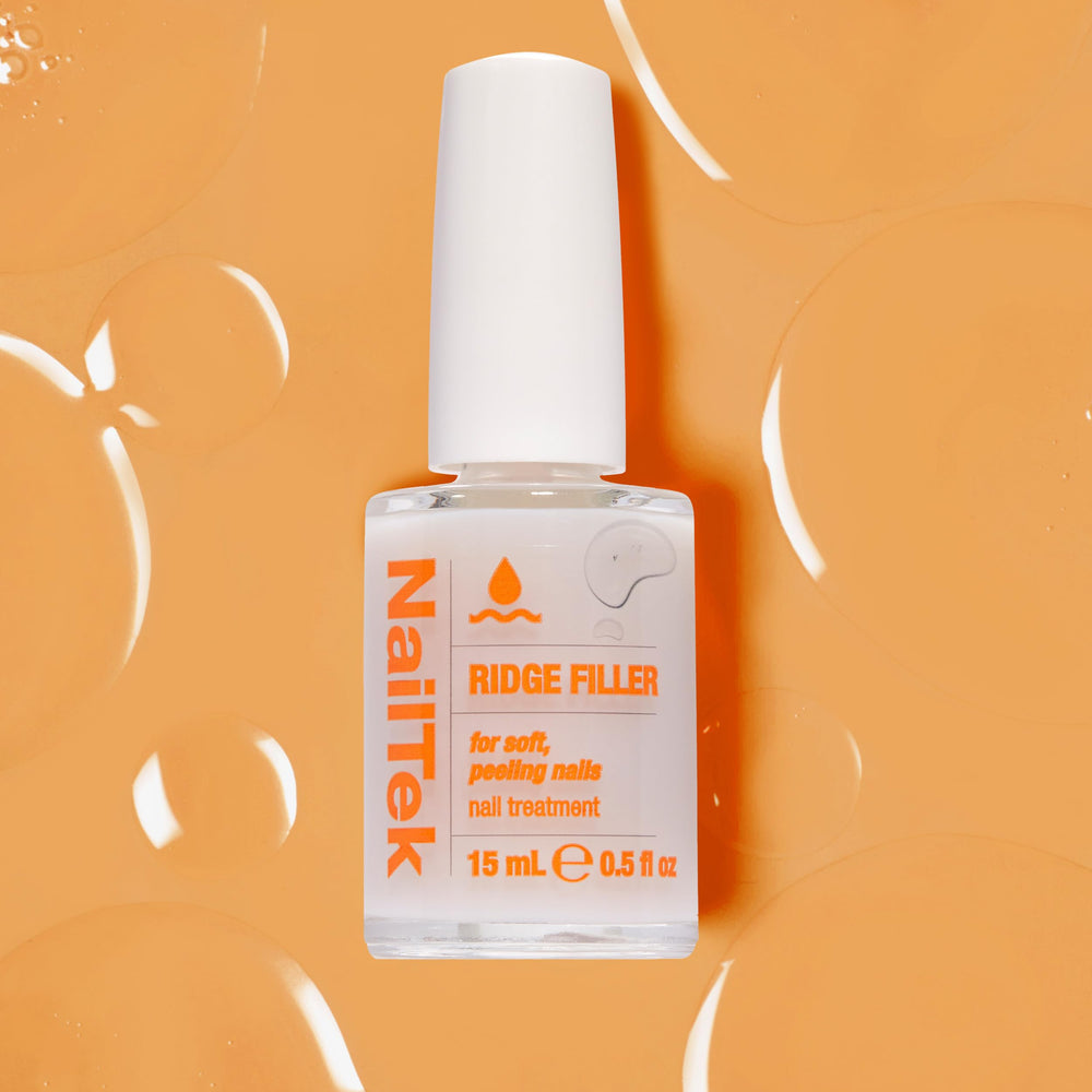 Nail Tek Ridge Filler smooths texture before color, improving polish adhesion.