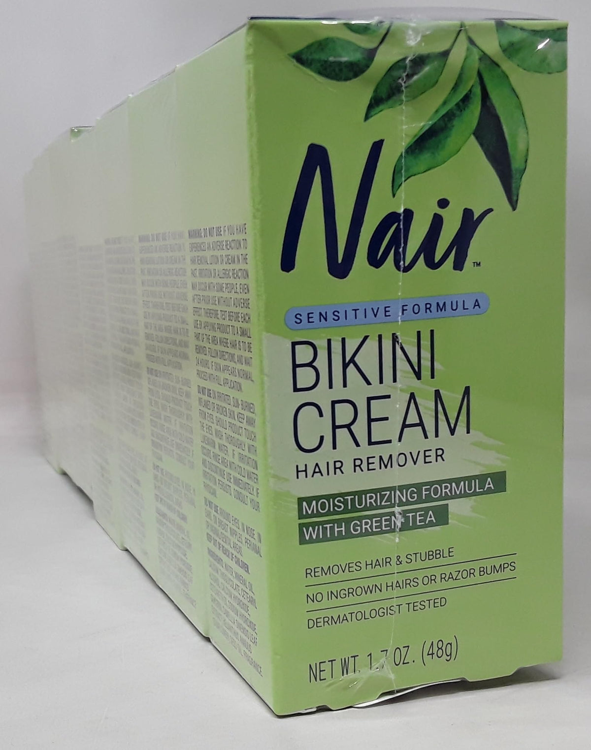 Nair bikini hair remover cream with green tea — front-view bottle, smooth bikini line.