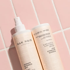 NAK Hair Hydrate Detangle Mist softens hair for manageable styling.
