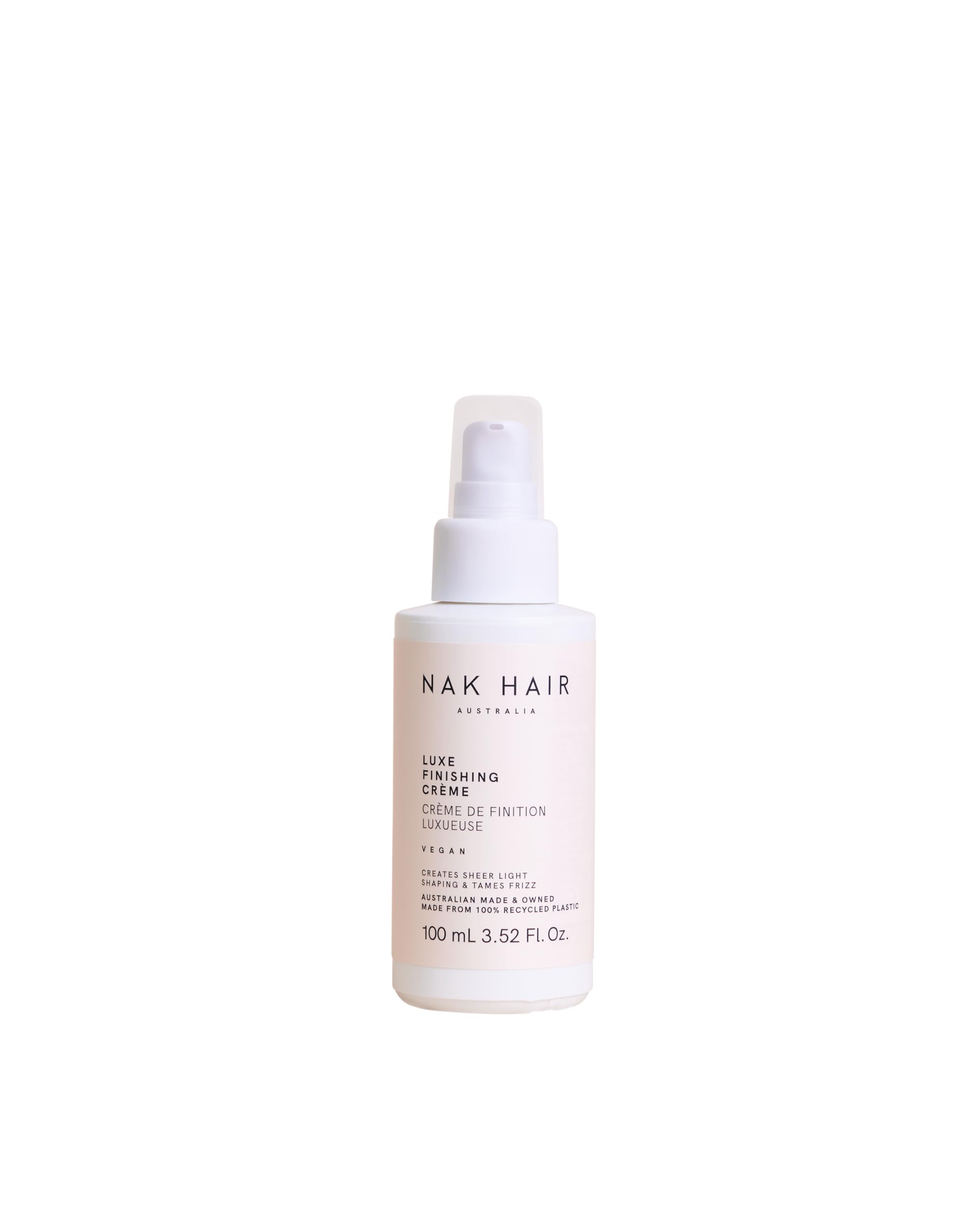 NAK Hair Luxe Finishing Creme bottle on vanity for light shaping and frizz control