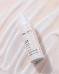 NAK Hair Curls Creme model showcases bouncy, defined curls