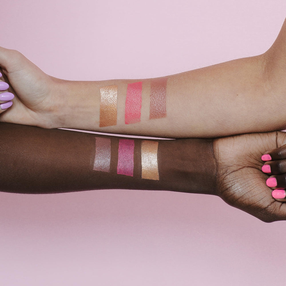 Naked Sundays Glow Balm on eyelids for rosy glow.
