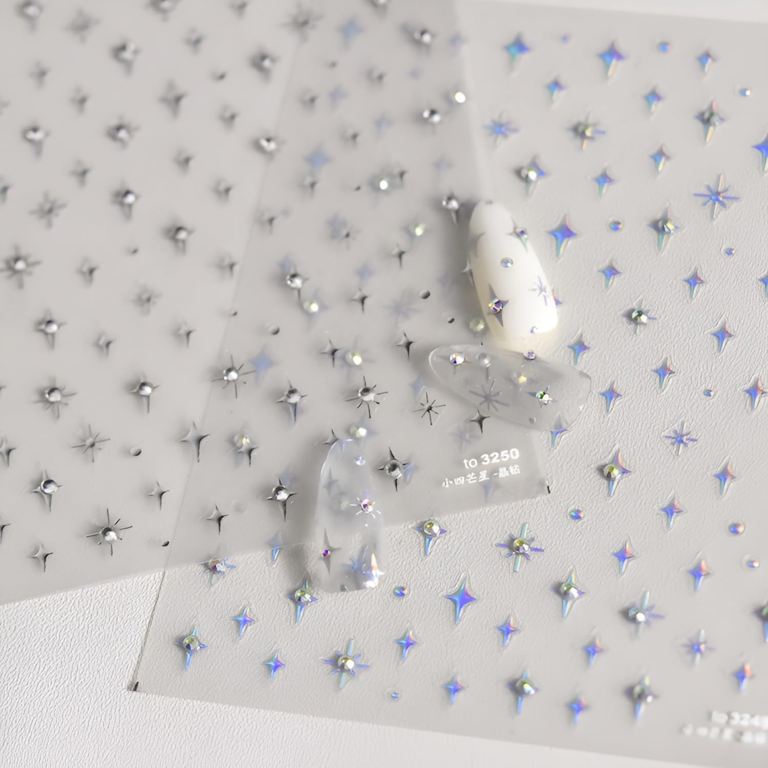 5D embossed star decals add glittery shine to nails.