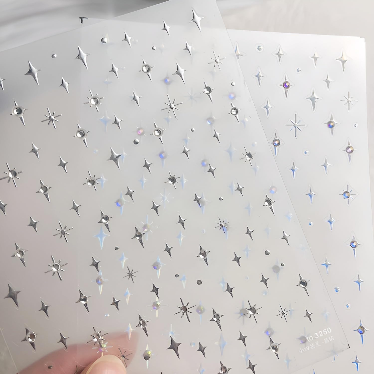 Two-sheet Namrec set offering versatile nail embellishments.