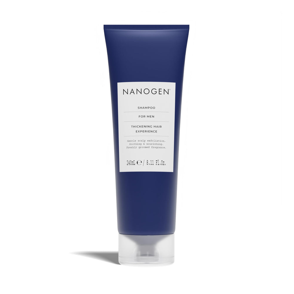Close-up of Nanogen Thickening Shampoo for Men bottle being squeezed for dispensing.