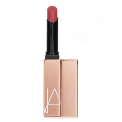 NARS Afterglow Sensual Shine Lipstick Turned On glossy finish close-up on lips
