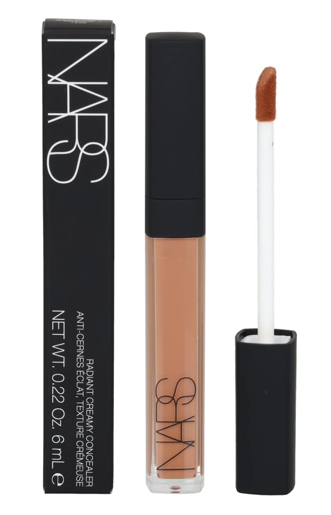 NARS Radiant Creamy Concealer Amande on fingertip shows creamy texture.