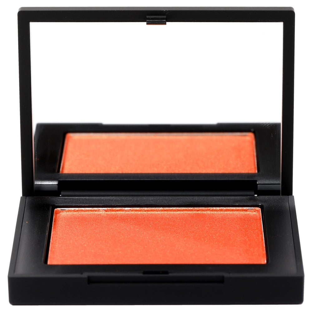 NARS Taj Mahal swatch showing warm golden-berry glow on skin