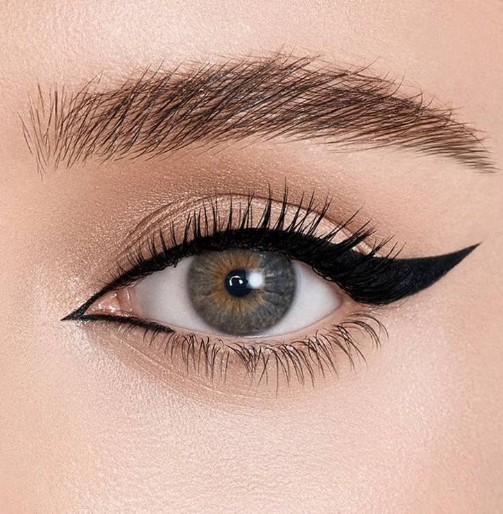 Natasha Denona Macro Blade Matte Black swatch on skin showing rich color payoff.
