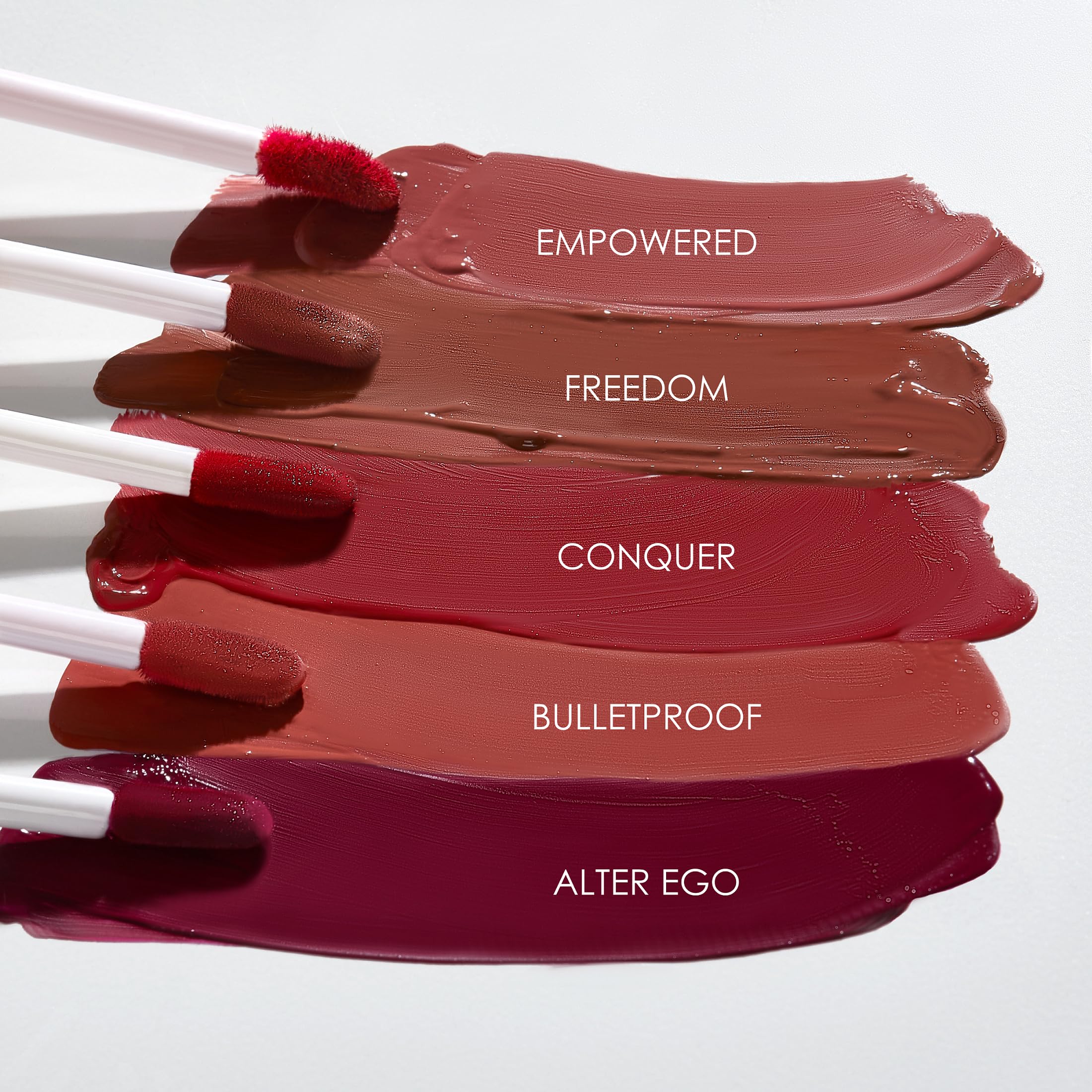 Close-up lips swatches reveal rich pigmentation and velvety matte finish.