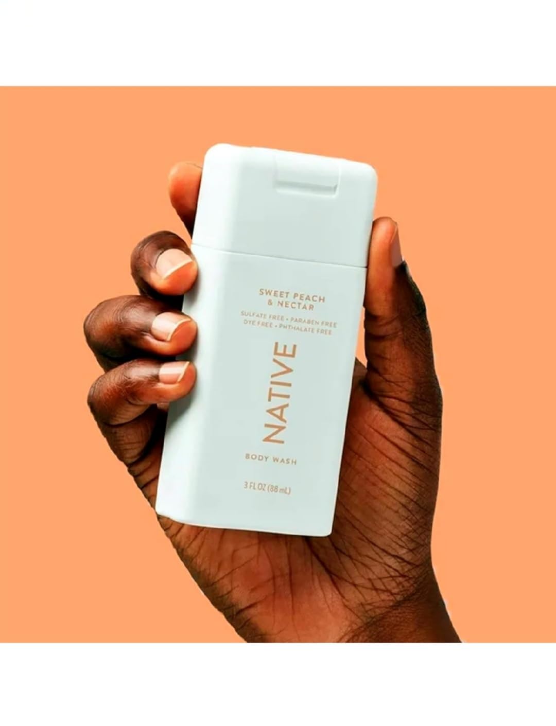 Native travel size body wash bottle with Sweet Peach Nectar scent for a refreshing cleanse