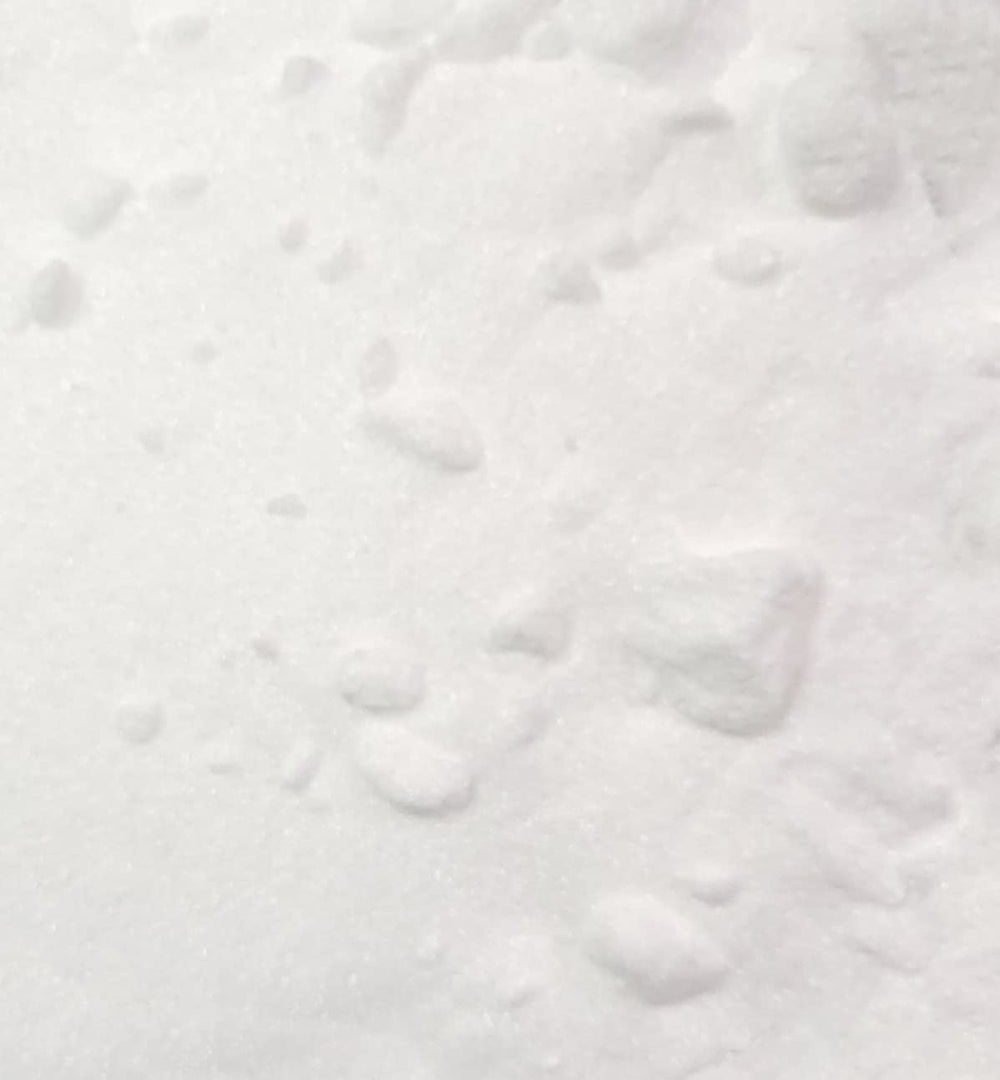 Naturejam Alpha Arbutin powder texture close-up with scoop for precise usage.