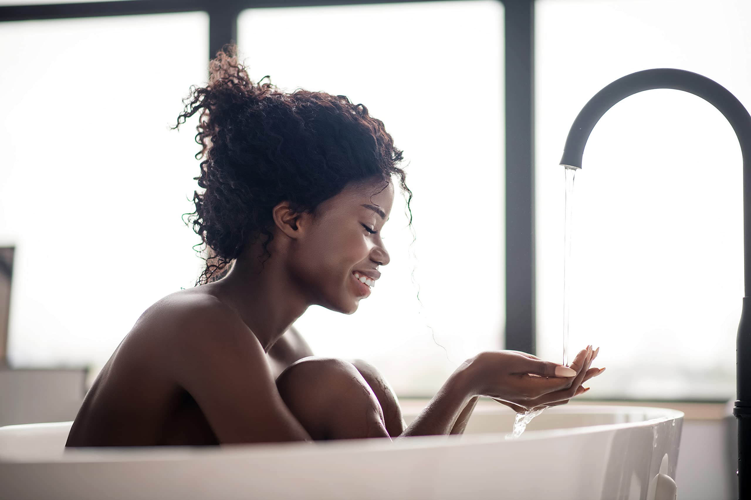 Spa-like soak scene with fizzing bath bomb in tub.