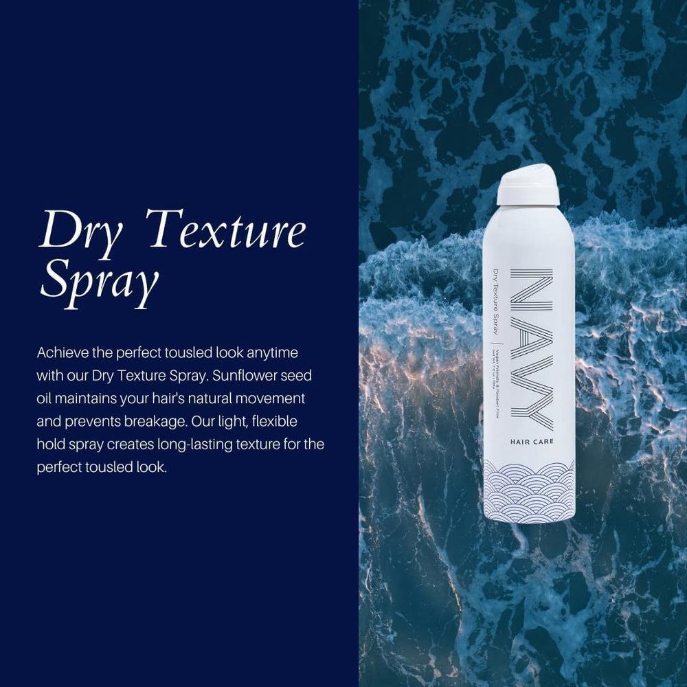 Navy Hair Care Dry Texture Spray misting in air to create texture