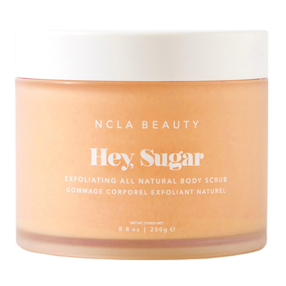 NCLA Beauty Hey Sugar bottle and spread demonstrates mango butter richness for hydration.