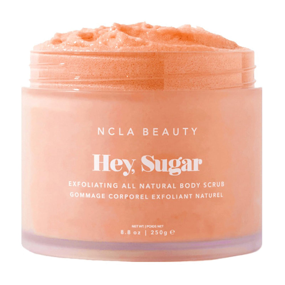 NCLA Beauty Hey Sugar peach scrub jar close-up shows creamy texture for exfoliation and hydration.