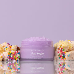 Close-up of sugar crystals in Hey Sugar scrub for gentle exfoliation.