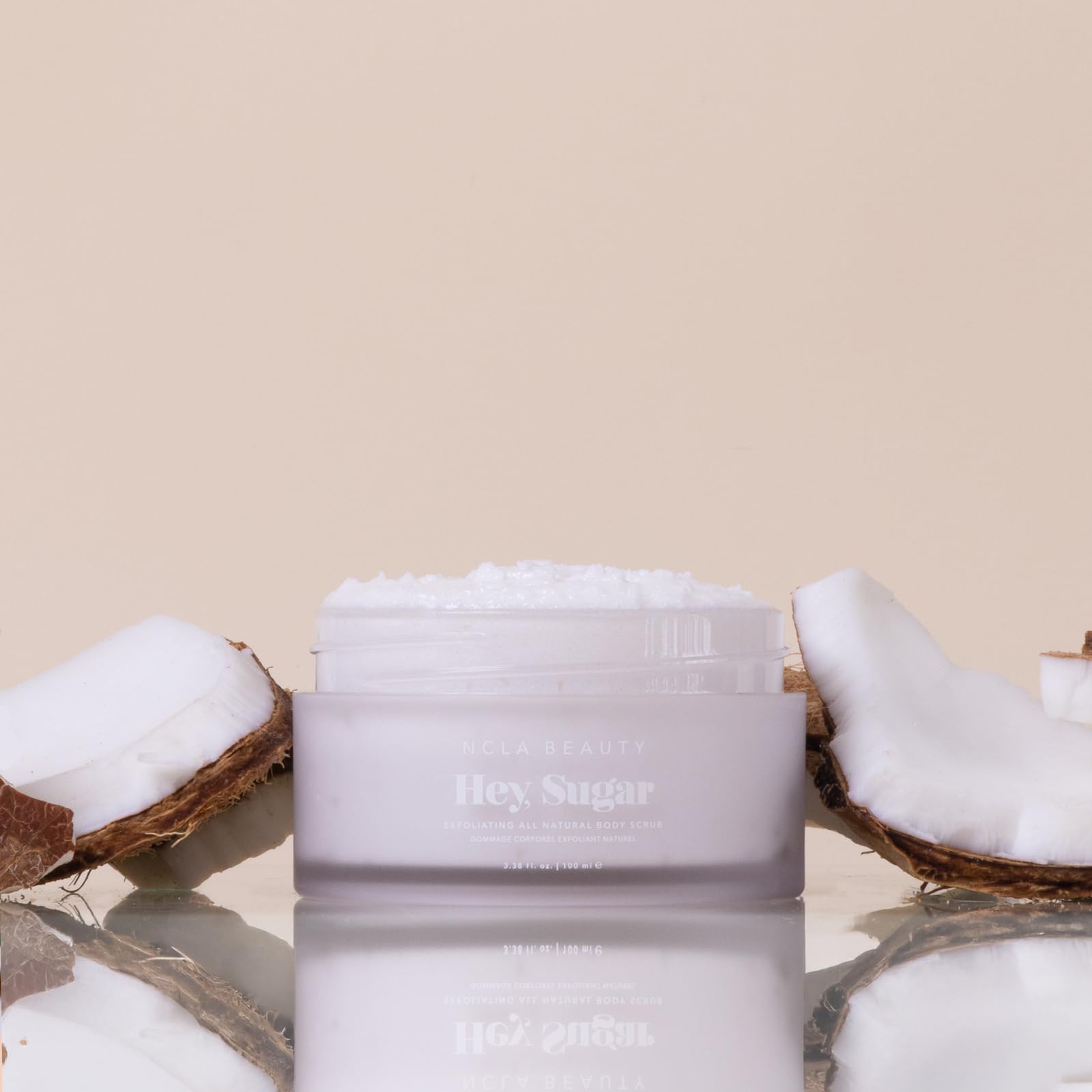 Close-up of sugar grains in Hey Sugar scrub for gentle body exfoliation