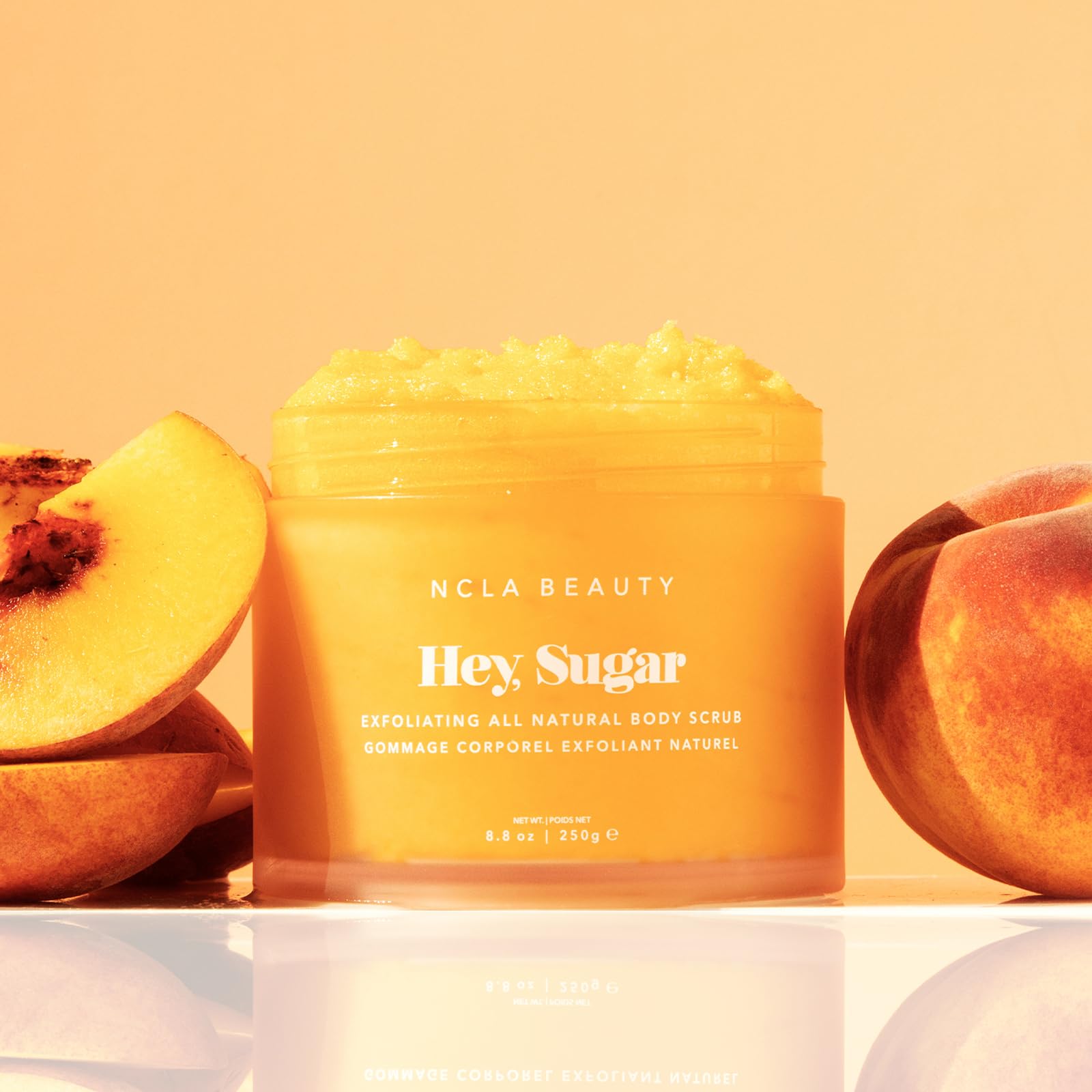 NCLA Beauty Hey Sugar sugar grains close-up highlights gentle exfoliation for smoother skin.