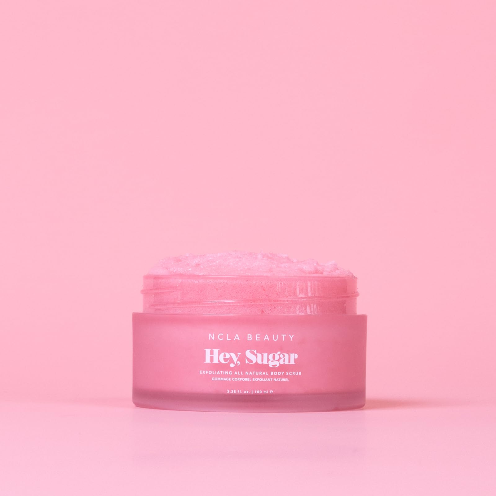 NCLA Beauty Hey Sugar exfoliating sugar grains gently polish skin during showers.