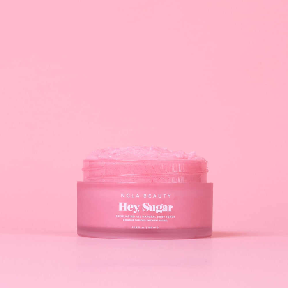 NCLA Beauty Hey Sugar exfoliating sugar grains gently polish skin during showers.