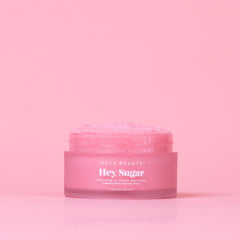 NCLA Beauty Hey Sugar exfoliating sugar grains gently polish skin during showers.