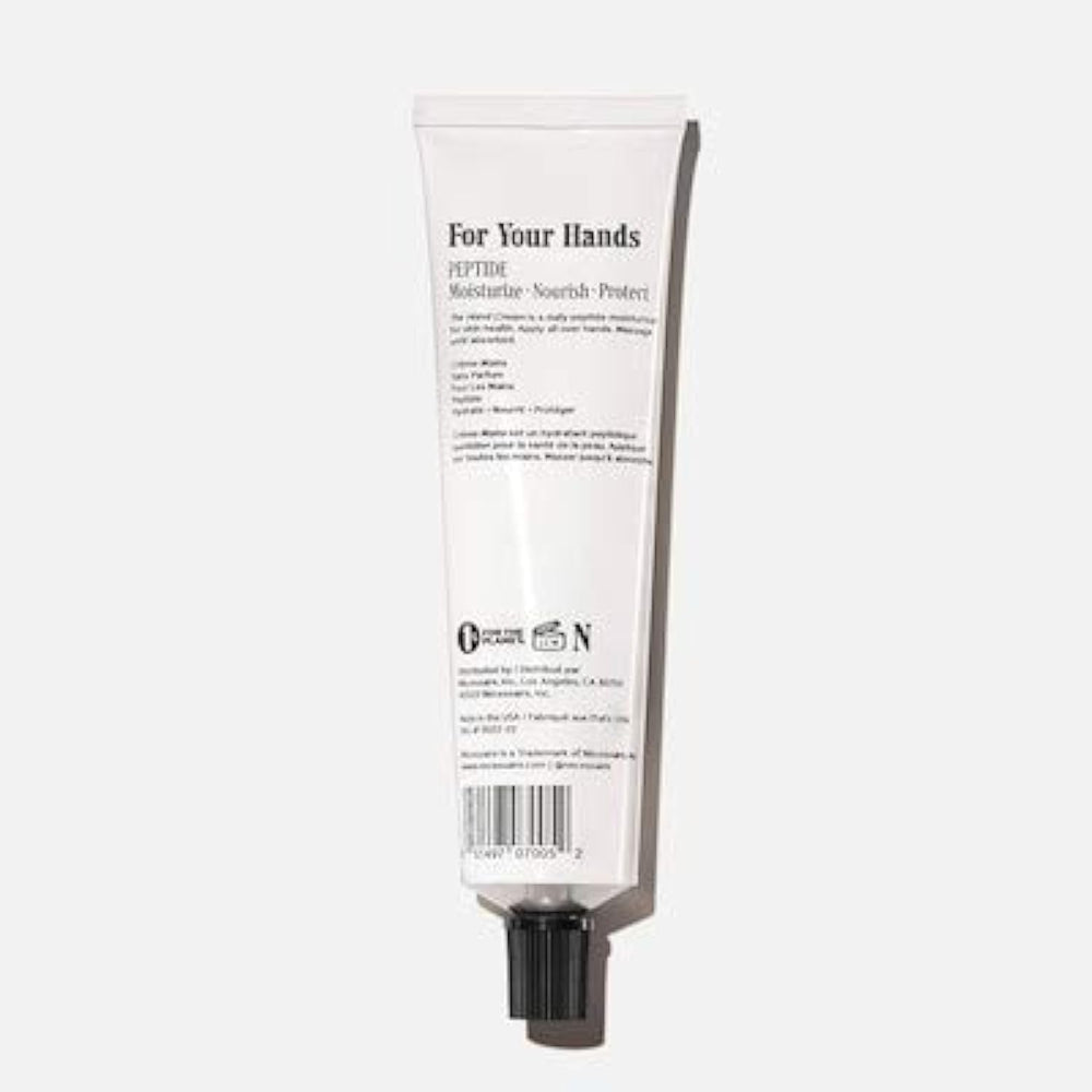 Nécessaire Hand Cream with Peptide texture close-up shows a non-greasy, fragrance-free formula.