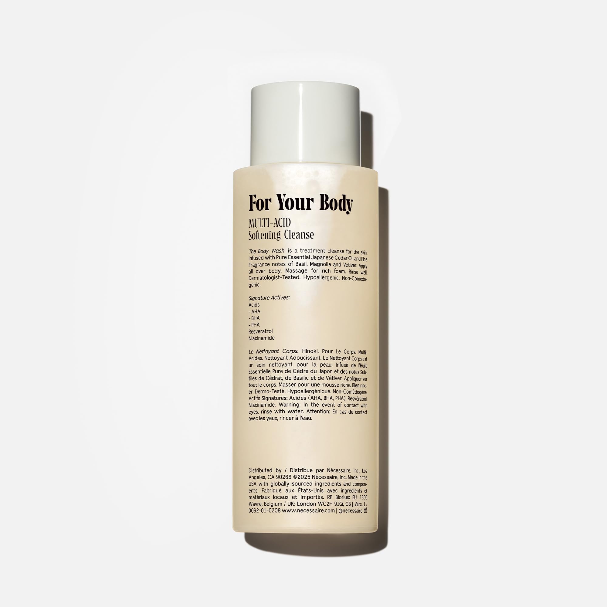 Nécessaire Hinoki bottle close-up highlights Niacinamide-infused formula for skin support.