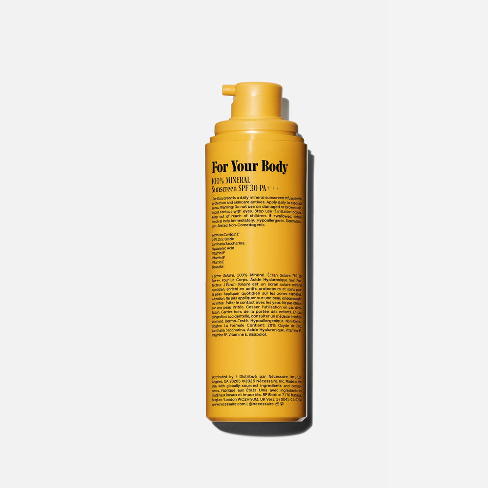 Nécessaire sunscreen on arm being spread for even coverage